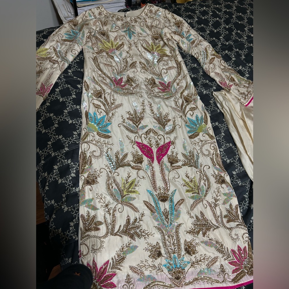 Ivory pure silk long kameez and trousers fully embellished
